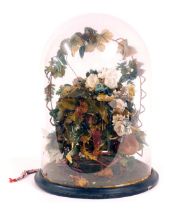 A Victorian wax fruit centrepiece, formed as a still life with central nest and flowers and fruit de