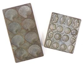 Two metal chocolate moulds, to include praline shells, flowers and fish, 13cm x 11cm and 19.5cm x 10