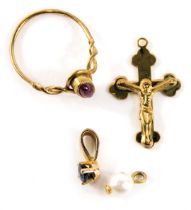 A group of 9ct gold jewellery, comprising a 9ct gold crucifix pendant, a 9ct gold and ruby set dress