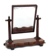 A Victorian mahogany toilet mirror, the rectangular mirror supported by octagonal columns with turne