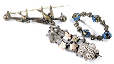 Two bar brooches, comprising a Victorian Forget me Not swallow brooch, 4.5cm diameter, a white metal
