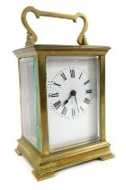 A French brass carriage clock, rectangular enamel dial bearing Roman numerals, single barrel movemen