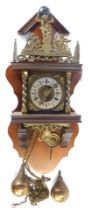 A Dutch Zaandam mahogany stoelklok wall clock, with brass moulded figures, and gentleman holding orb