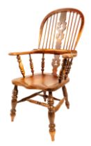 A 19thC elm and ash Windsor chair, with Christmas tree splat, scrolling arms and shaped seat,