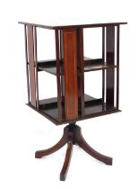 A George V mahogany revolving bookcase, with boxwood inlay and presentation plaque 'presented to Rev