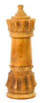 A carved treen chess piece needle case, formed as the tower, 6cm high. (AF)