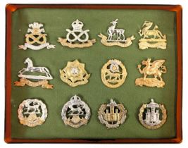 A group of military cap badges, to include North Stafford Regiment, West Yorkshire Regiment, Essex R