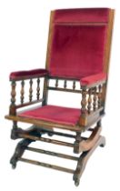 A late 19thC American walnut rocking chair.