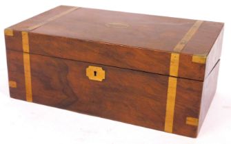 A 19thC mahogany campaign writing box, with brass bound decoration and shield, with a fitted