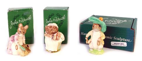 Three Beswick figures, comprising Mrs Tiggy-Winkle gold, Hunca Munca Sweeping gold, and Benjamin Bun