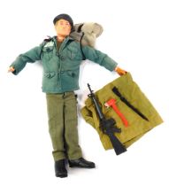 A Palitoy Action Man figure, in fatigues, 28cm high. (AF)