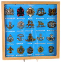 A group of military cap badges, to include King's Royal Rifle Corps, Manchester regiment, East Lanca