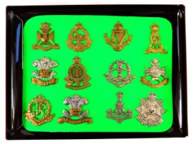 A group of military cap badges, to include Royal Army Ordnance Corps, Military Policemen, Fishguard,