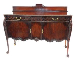 A George V mahogany serpentine fronted sideboard, with low gallery back, blind fret ornamentation, w