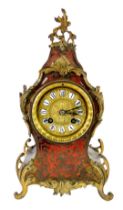 A 19thC French Boulle work mantel clock, the circular embossed brass dial bearing raised porcelain R