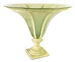 An Art Deco centrepiece, with an inverted trumpet frosted glass vase, within a cream painted frame,