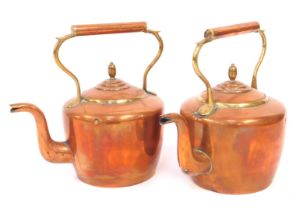 Two 19thC copper and brass kettles, 31cm high.