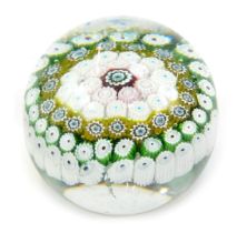 A concentric millefiori glass paperweight, 8cm wide.