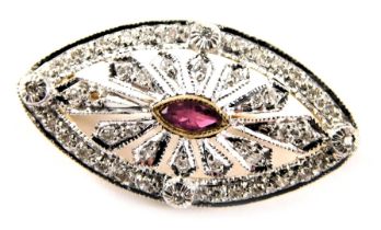 A 9ct gold framed oval brooch, set with tiny diamonds in white gold setting, with a teardrop cut cen