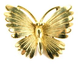 A butterfly brooch, yellow metal stamped 375, 2.5cm wide, 3.4g.