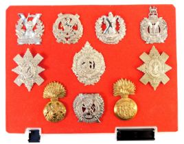 A group of military cap badges, to include Tyneside Scottish, Black Watch, Argyll and Sutherland Hig