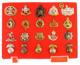 A group of military cap badges, to include Royal Welsh Fusiliers, Royal Army Dental Corps, Army Cate