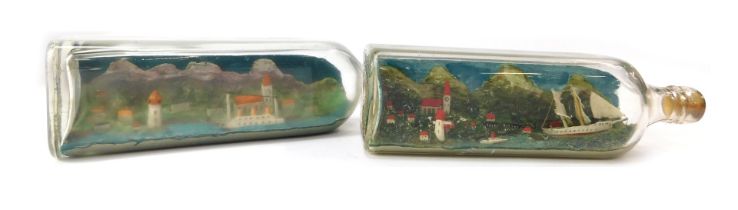 Two diorama ship scenes within bottles, possibly Scandinavian scenes, with ships and harbours, etc,