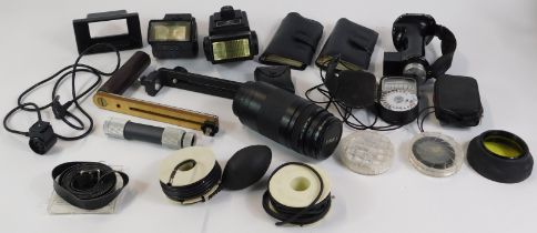 A group of camera and optics equipment, comprising Tamron camera case, Canon Zoom lens EF 75-300mm 1