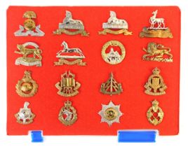 A group of military cap badges, to include Army Educational Corps, Lincolnshire Regiment, Leicesters
