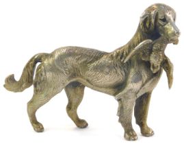 A silver plated model of a retriever carrying duck, 14cm high.