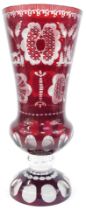 A Bohemian cut glass cranberry flash vase, of inverted trumpet form, on circular base with etched de