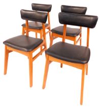 A set of four Schreiber dining chairs, each with a leatherette padded seat and back, on tapering leg