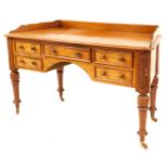 A Victorian mahogany dressing table, with canted sides, having shaped low gallery back and with thum