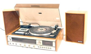 A Sanyo turntable, together with a pair of Sanyo teak cased speakers.