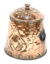An Arts and Crafts copper lidded coal bin, of cylindrical tapering form with hammered decoration and