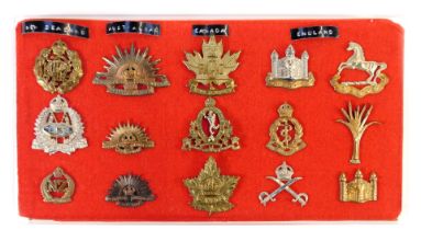 A group of military cap badges, for New Zealand, Australia, Canada and England. (15)