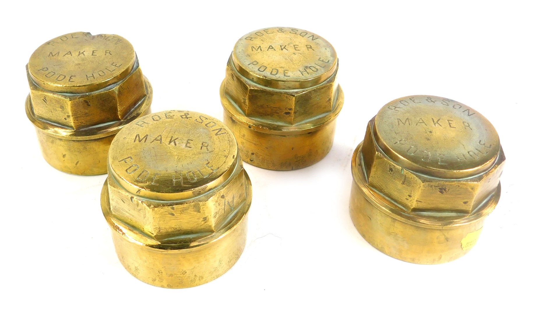 Four brass hubcaps, by Roe & Son Pode Hole.