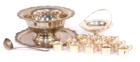 A silver plated punch bowl, together with twelve cups, ladle, a salver or stand, and a plated basket