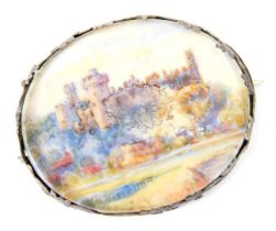 A portrait brooch, with oval panel with painted watercolour of Windsor Castle, in a white metal moun