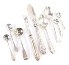 A group of silver and white metal cutlery, comprising Victorian silver fiddle pattern toddy ladle, t