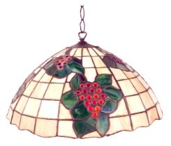 A 20thC Tiffany style light shade, of cylindrical tapering form decorated with bunches of grapes, le