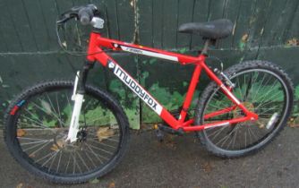 A Muddy Fox Rebel bicycle, in red trim.
