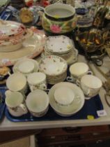 A Heathcote China part tea service, with floral decoration and butterflies, and a Burslem planter.