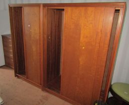 Two similar mid century teak wardrobes, together with a teak five drawer chest, 95cm high, 77cm wide