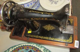 A Singer sewing machine, model EC140648.