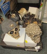 A group of skull ornaments, tribal motorbike riders, coffin, jugs, clothing, etc. (4 boxes and 1 bag