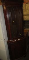 A walnut finish corner cabinet. WARNING! This lot contains untested or unsafe electrical items. It