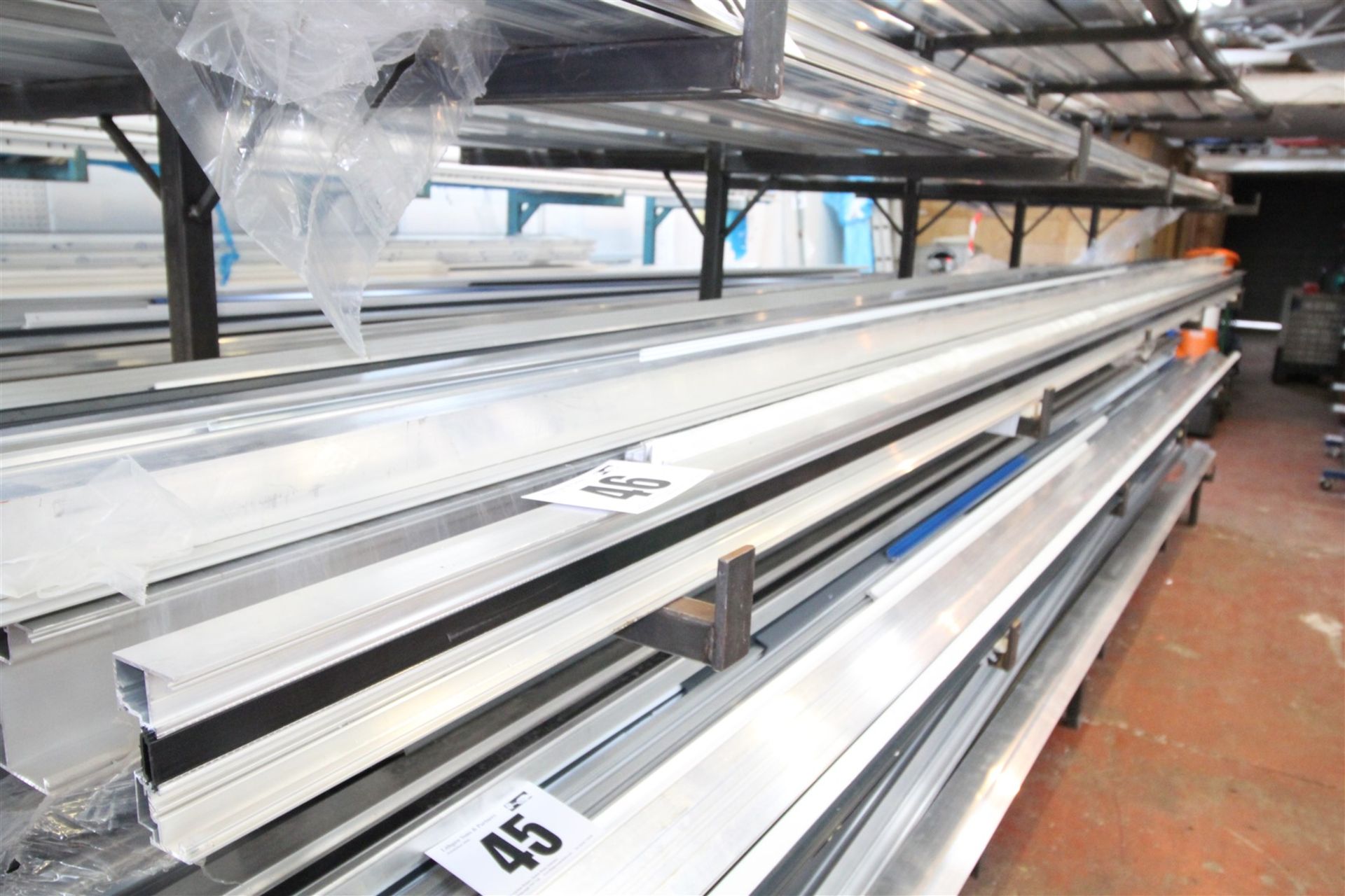 CONTENTS OF 28INCH WIDE SHELF OF RACK OF 5M LONG & SHORTER ALUMINIUM EXTRUSION & BOX SECTION.