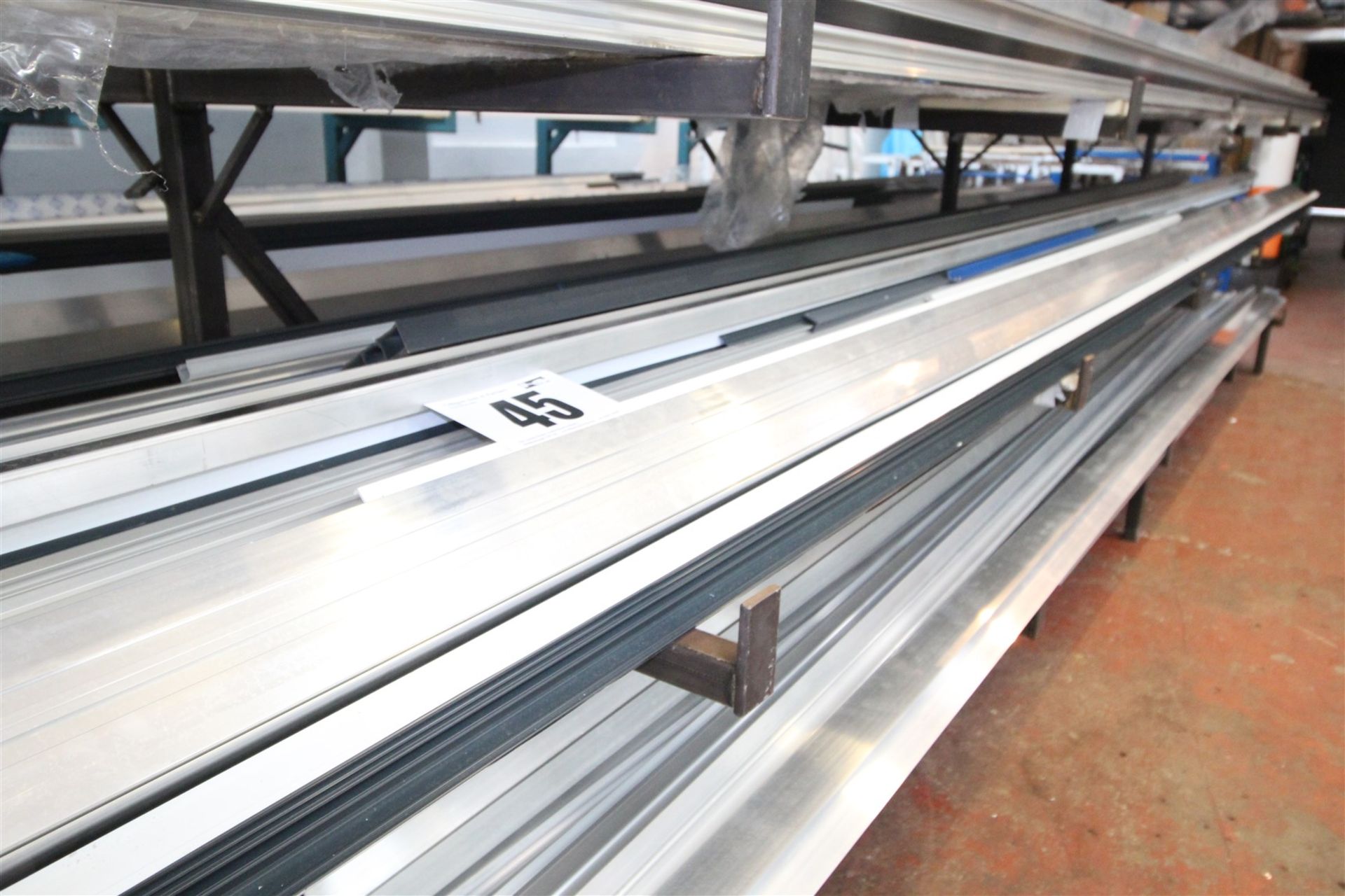 CONTENTS OF 28INCH WIDE SHELF OF RACK OF 5M LONG & SHORTER ALUMINIUM EXTRUSION & BOX SECTION.