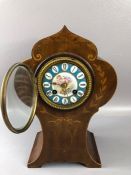 Antique mantle clock with inlay. Blue ground face Cupid decoration, approx 30cm tall winds and